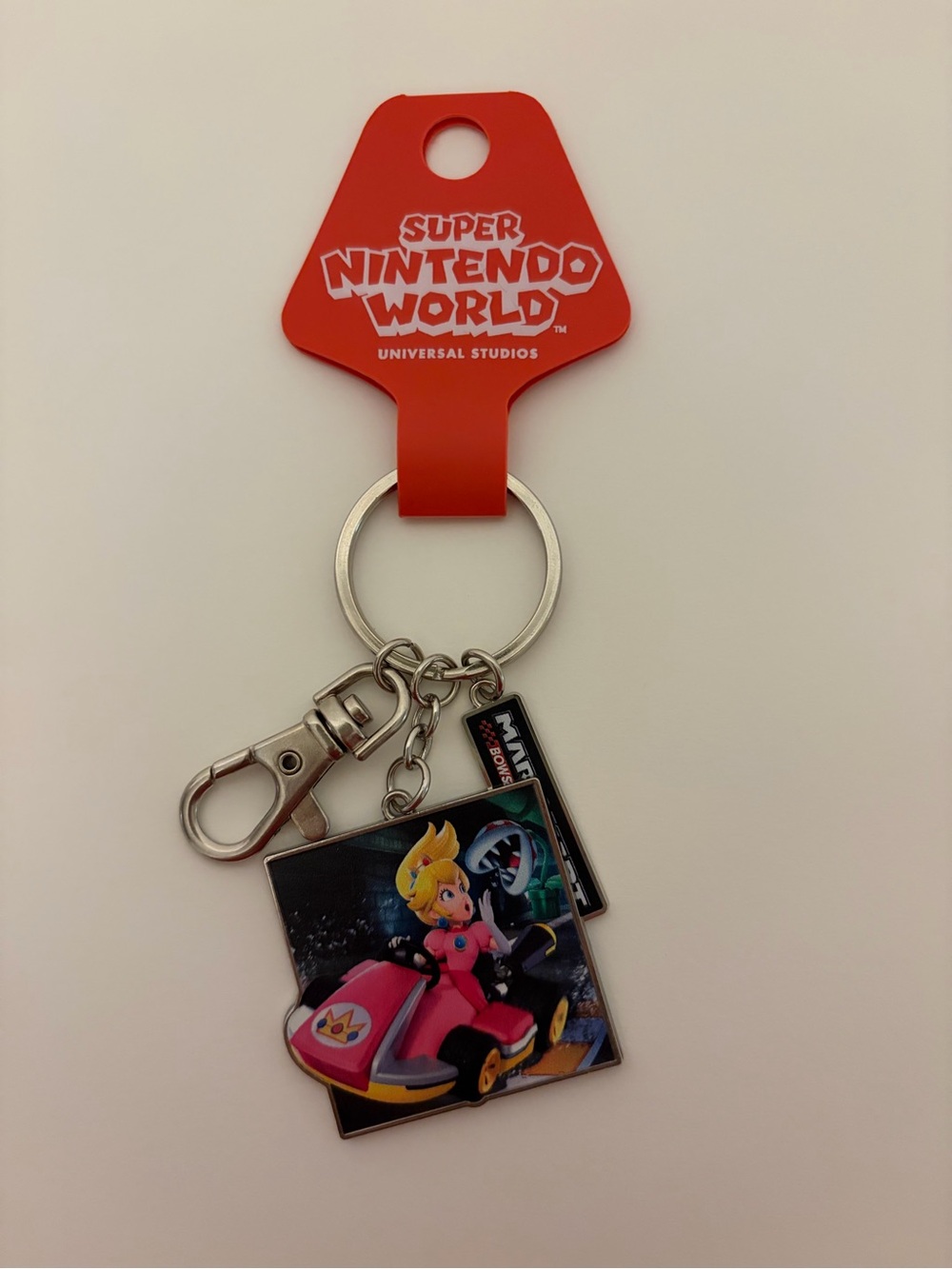 Nintendo Super Nintendo World Peach Kart Keychain - Red, Pink, Silver